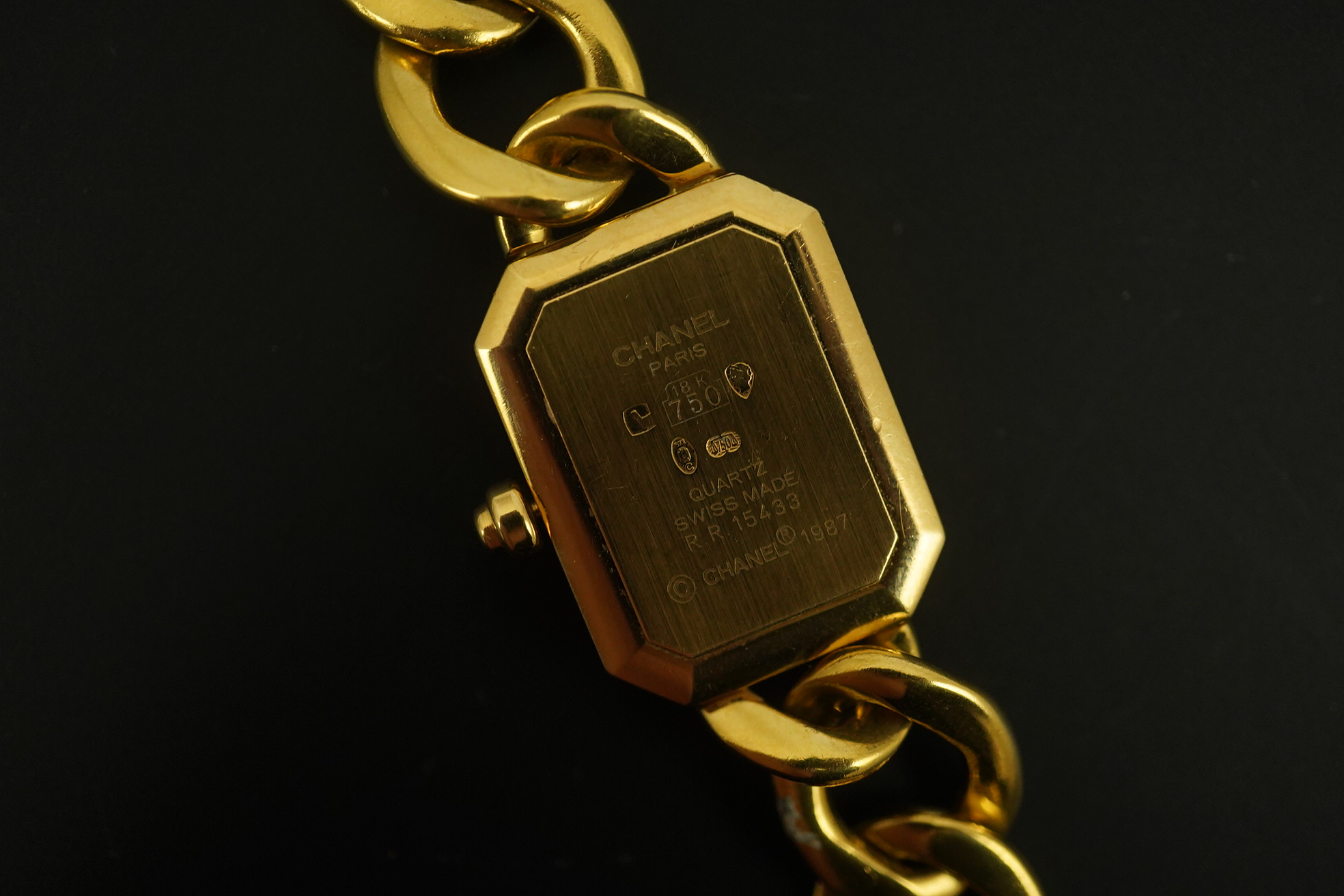 A lady's modern 18ct gold and diamond set Chanel quartz wrist watch, on an 18ct gold Chanel oval link bracelet
